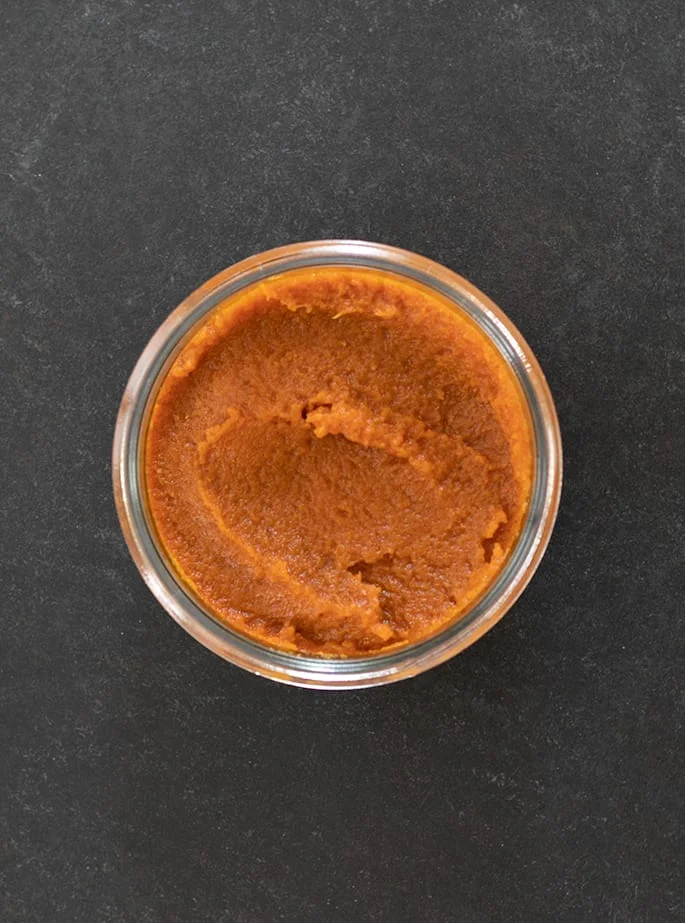 Pumpkin butter in glass jar overhead image
