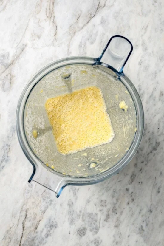 Pureed corn and broth in blender.
