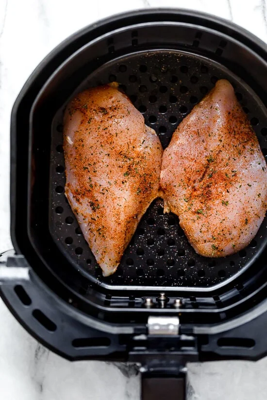 raw chicken in air fryer basket
