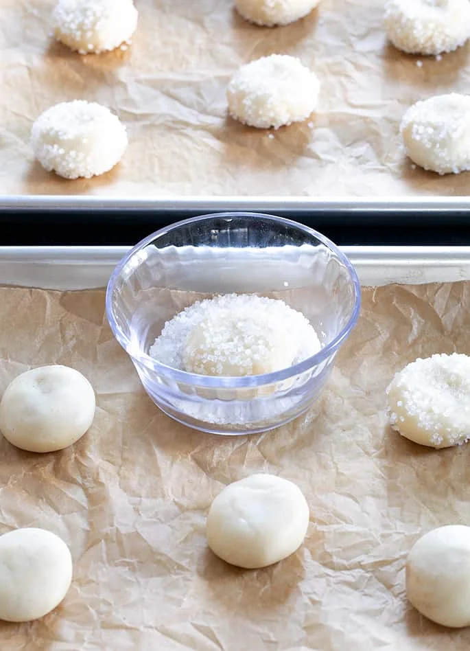 Raw drop sugar cookie dough on trays.