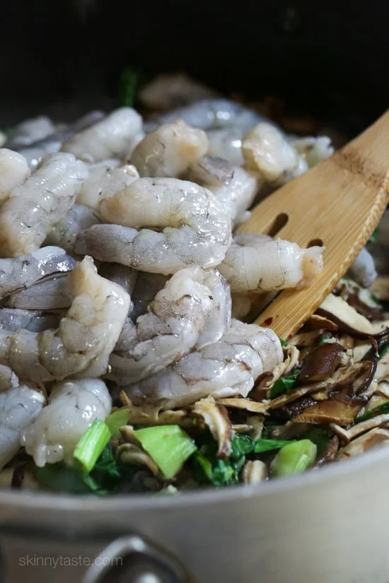 Raw shrimp added to the stir fry.