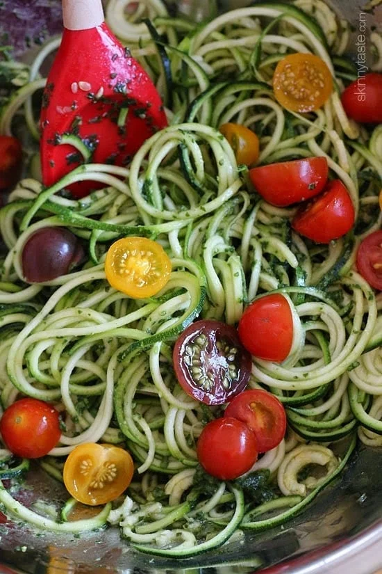 Raw Spiralized Zucchini Noodles with Tomatoes and Pesto is my favorite easy, end-of-summer vegetarian dish made with raw, garden vegetables and homemade pesto.