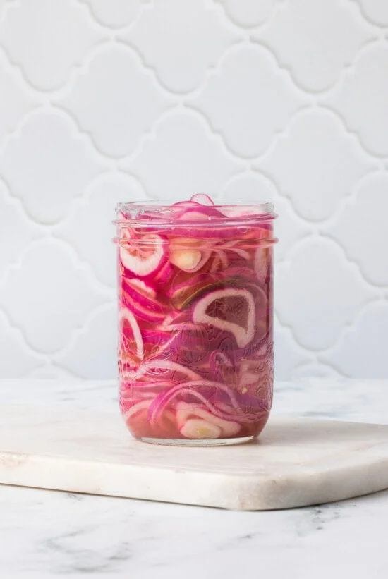 red onions in mason jar