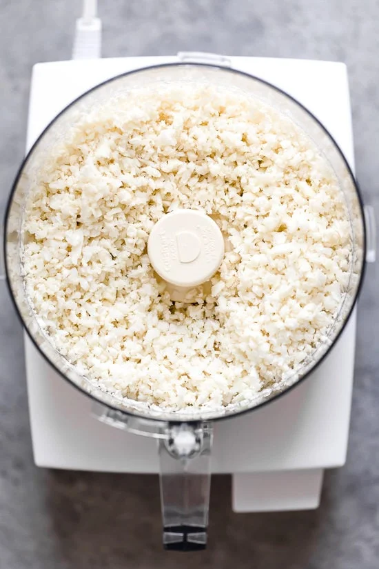 Riced cauliflower in food processor.