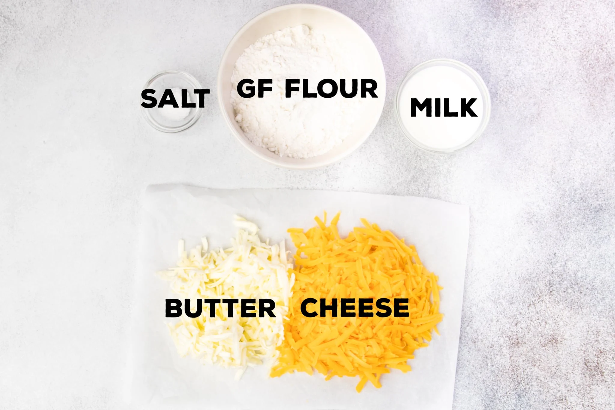 Salt, GF Flour, milk, butter and cheese ingredients for cheese crackers