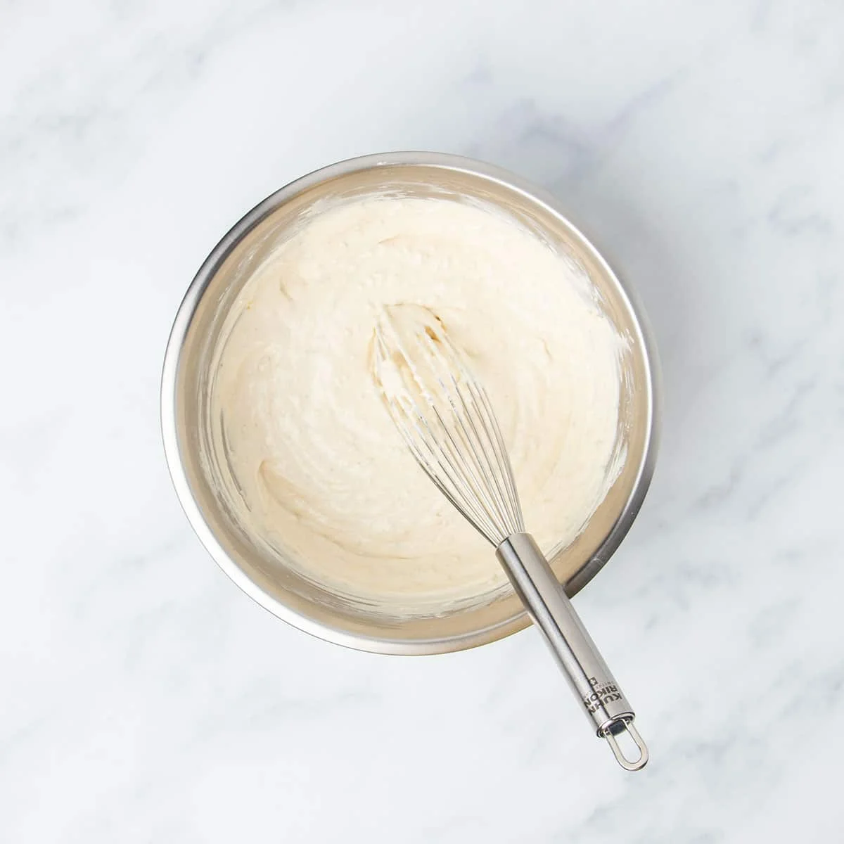same bowl with dry ingredients whisked into sour cream mixture with same whisk