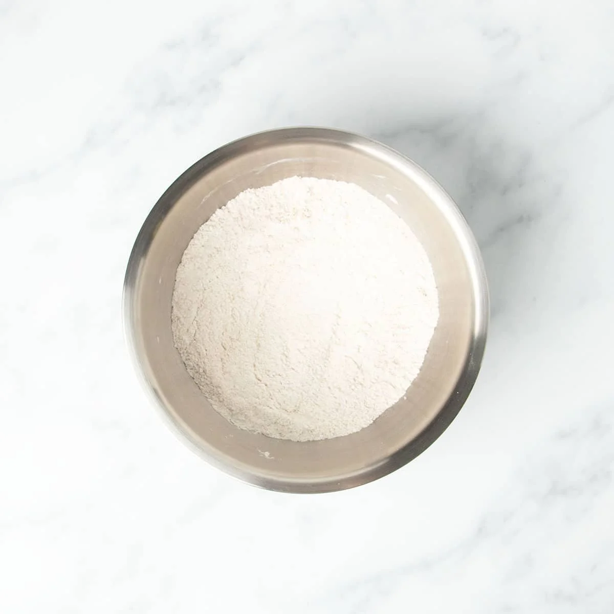 same mixing bowl with whisked white powder