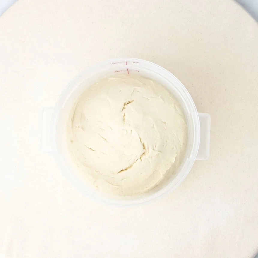 same pizza dough in same bucket, now risen