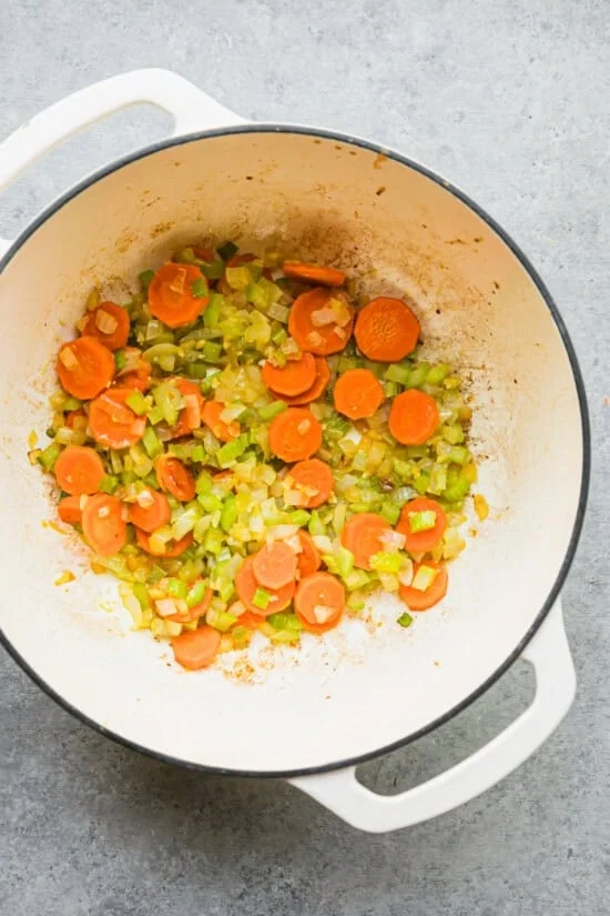 Sautéed veggies in a pot.