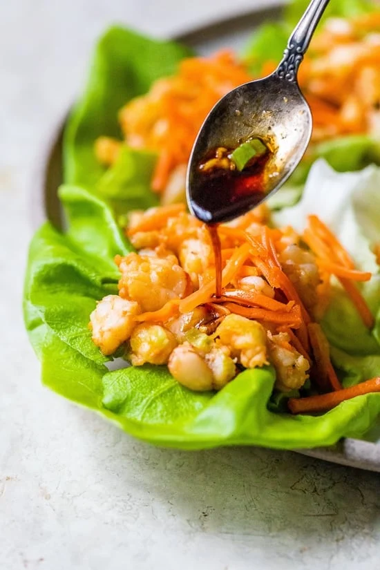 Shrimp Dumpling Lettuce Wraps with sauce and spoon