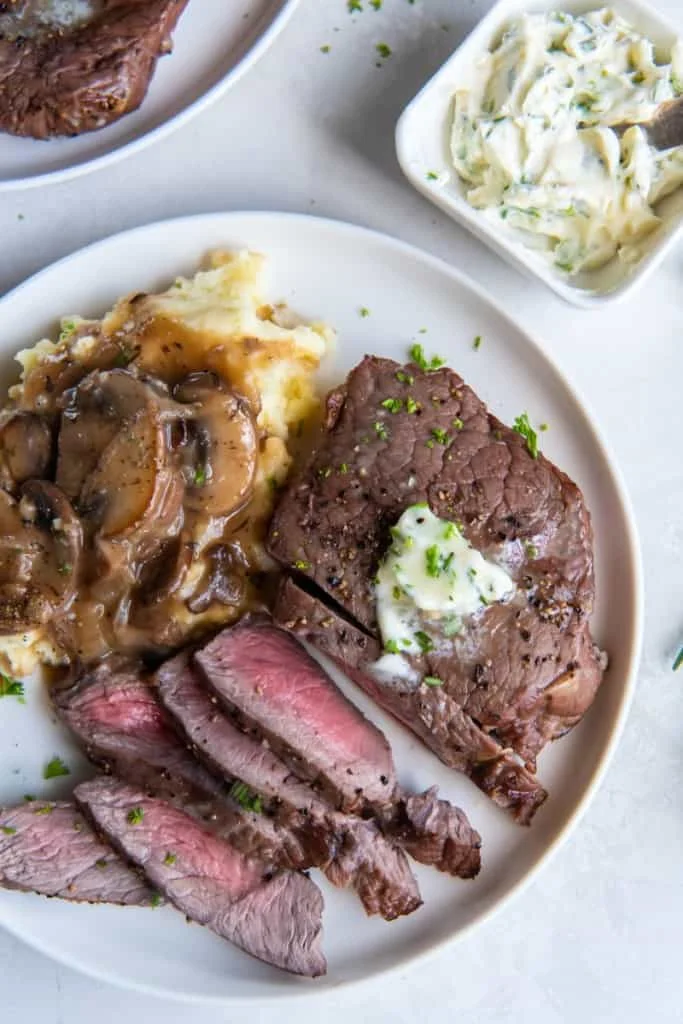 sliced sirloin steak on a plate