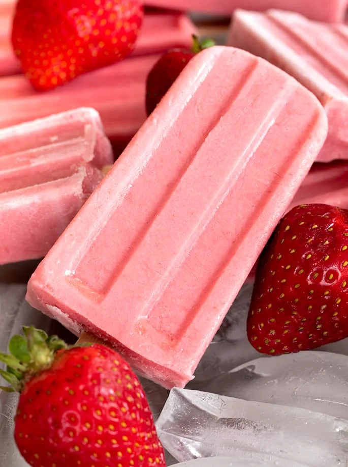 Smooth and creamy, naturally gluten free strawberry yogurt popsicles are perfect for a refreshing breakfast on the go, or an afternoon snack. Make them with fresh or frozen berries.