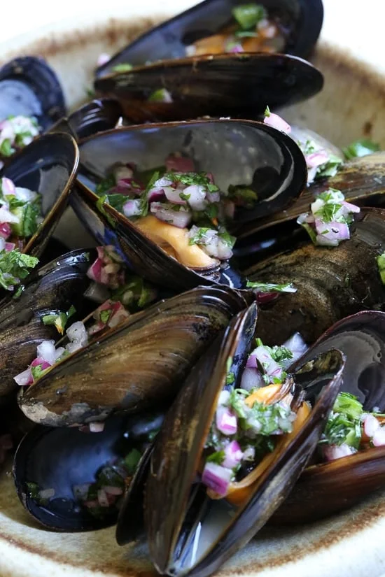 Steamed mussels get a kick with spicy Piri Piri Sauce which is basically a kicked up chimichurri sauce. 