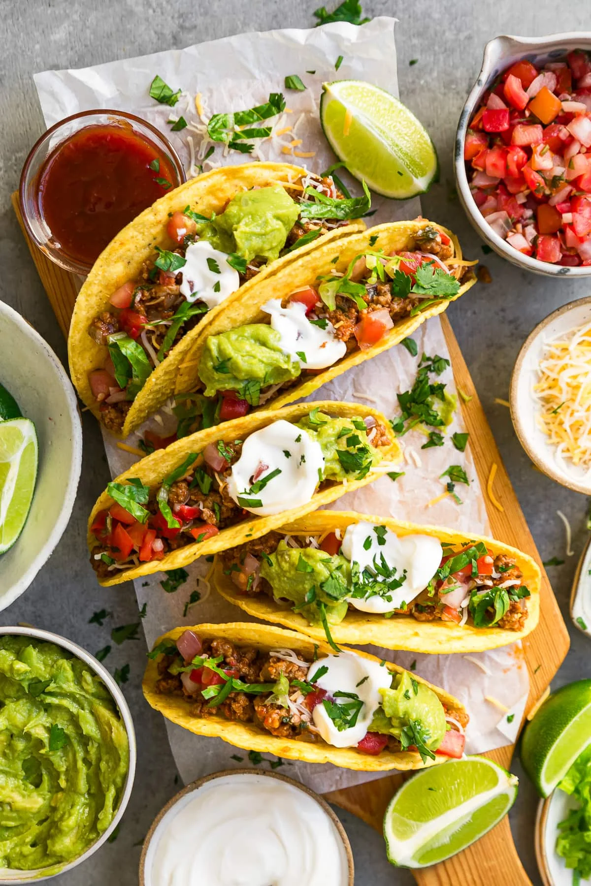 tacos and all the fixins on a board
