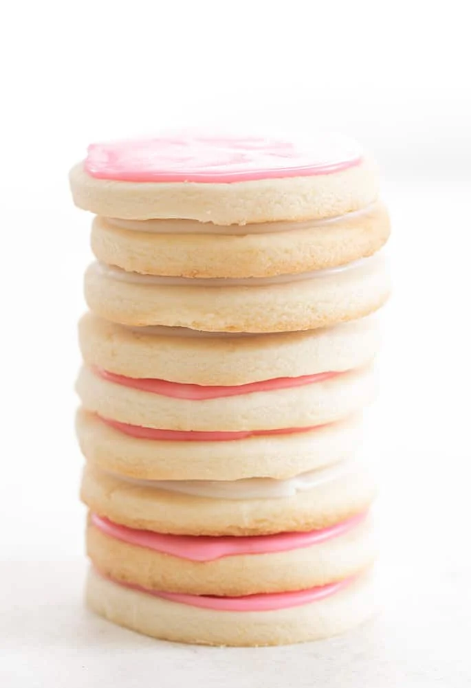 Tall stack of meltaway cutout cookies with icing