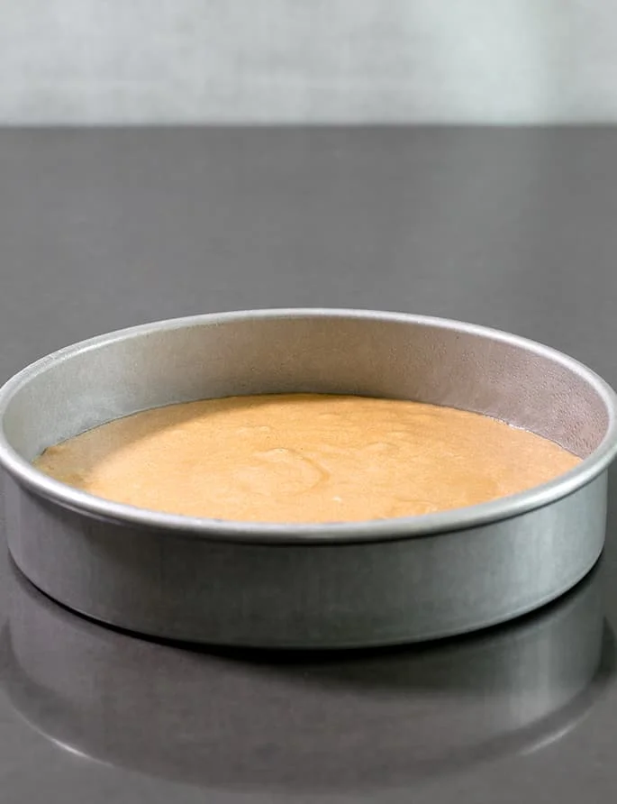The batter in a cake tin.