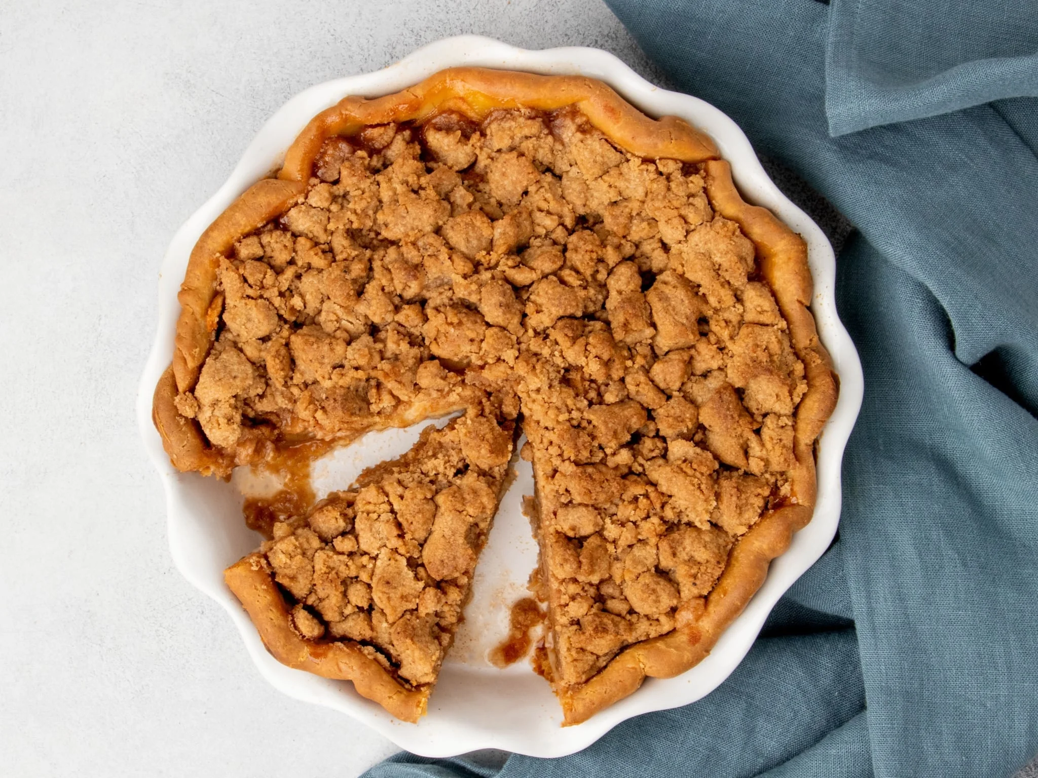 The finished recipe with a wedge-shaped slice removed to reveal the tender spiced filling.