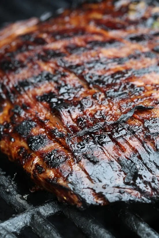 The marinade in this Grilled Asian-style Soy Marinated Flank Steak takes an uninteresting piece of steak and turns it into a mouthwatering dish!