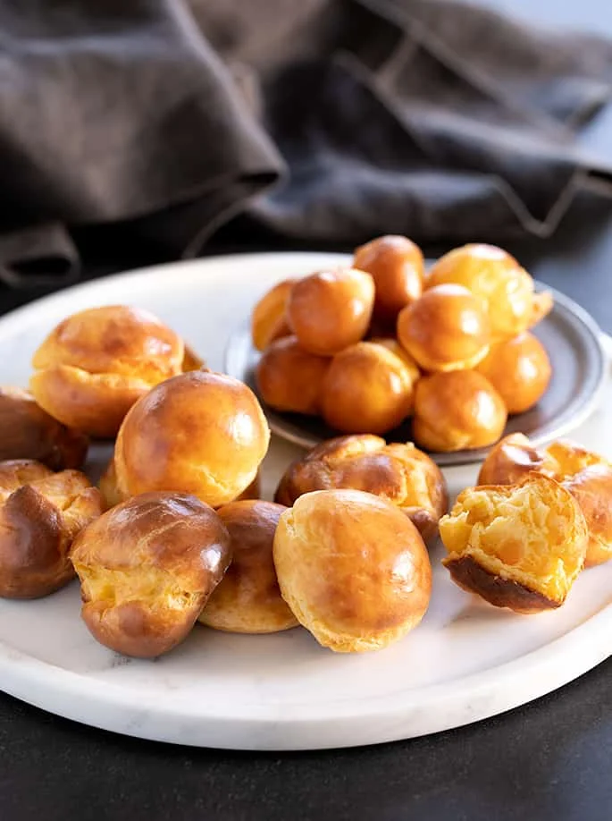 There are just 5 basic ingredients in these simple but fancy little cheese puffs with the funny French name, gougères. They'll never know they're gluten free unless you tell!