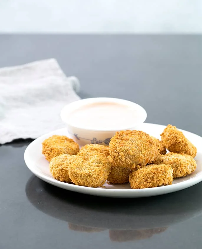 These Air Fryer chicken nuggets really are super crispy but made with almost no oil and in just minutes. If you're wondering how to use this new fun appliance, they're a great place to start!
