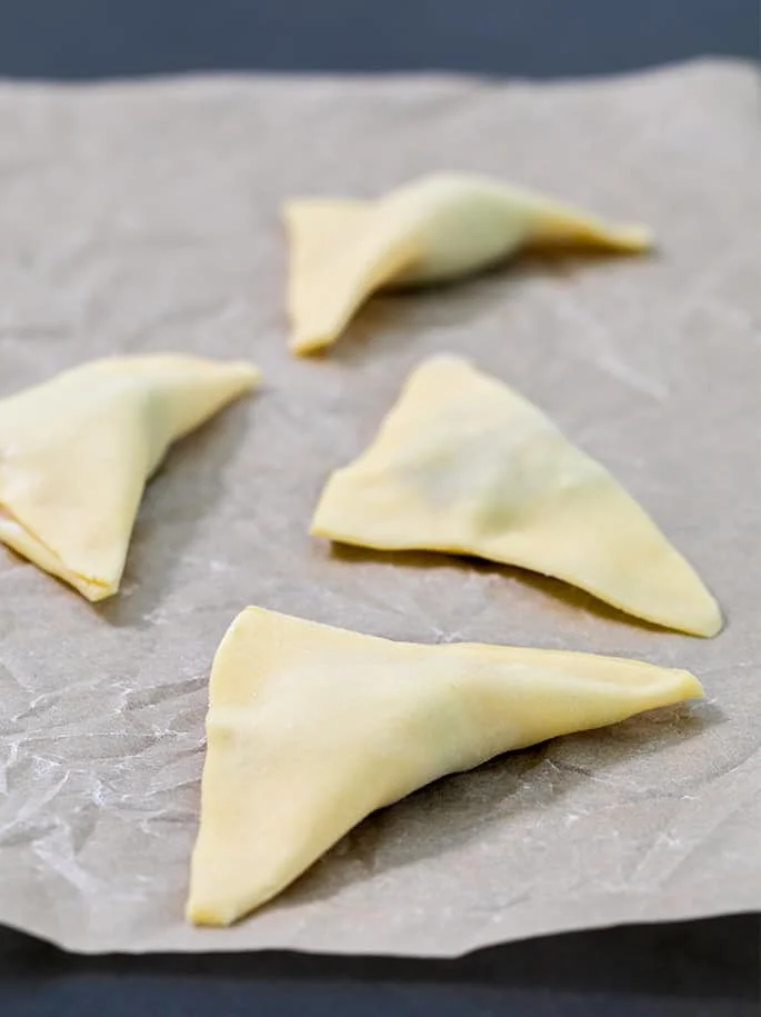 These Air Fryer fried wontons are made with very little oil but are still super crispy and crunchy. They'll be the first thing to go at a party!