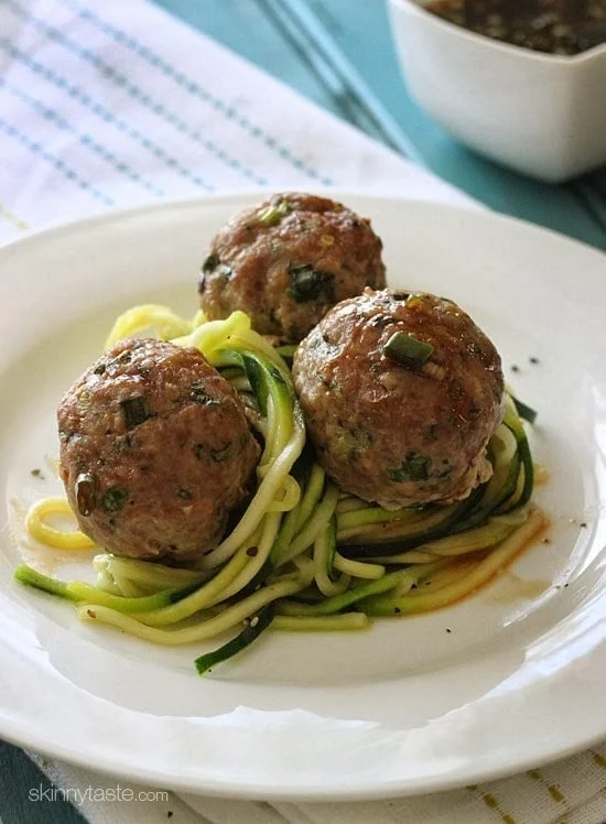 These Asian inspired meatballs are out of this world! Made with ground turkey, ginger, scallions, cilantro and sesame oil with a tangy sesame-lime dipping sauce