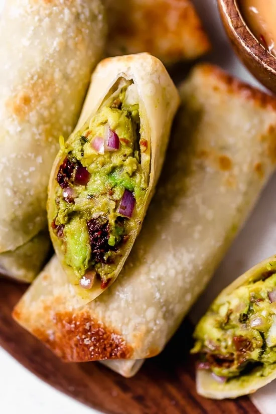 These Avocado Egg Rolls are inspired by the Cheesecake Factory egg rolls, only healthier because they are not fried. An easy air fryer recipe or bake them in the oven!