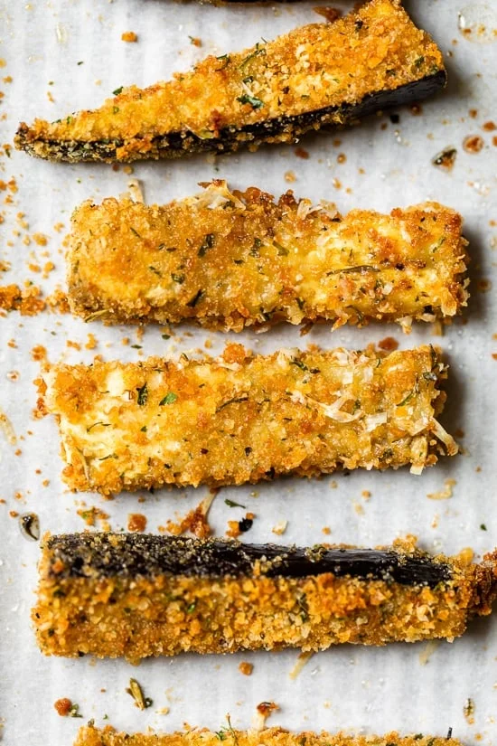 These Baked Eggplant Sticks are breaded with Italian breadcrumbs and Parmesan, baked or air-fried until golden, and served with a quick marinara sauce.