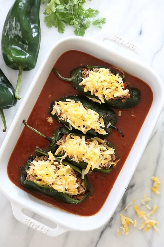 These baked Turkey Enchilada Stuffed Poblanos Rellenos are peppers stuffed with a flavorful ground turkey filling, topped with my homemade enchilada sauce and cheese. 