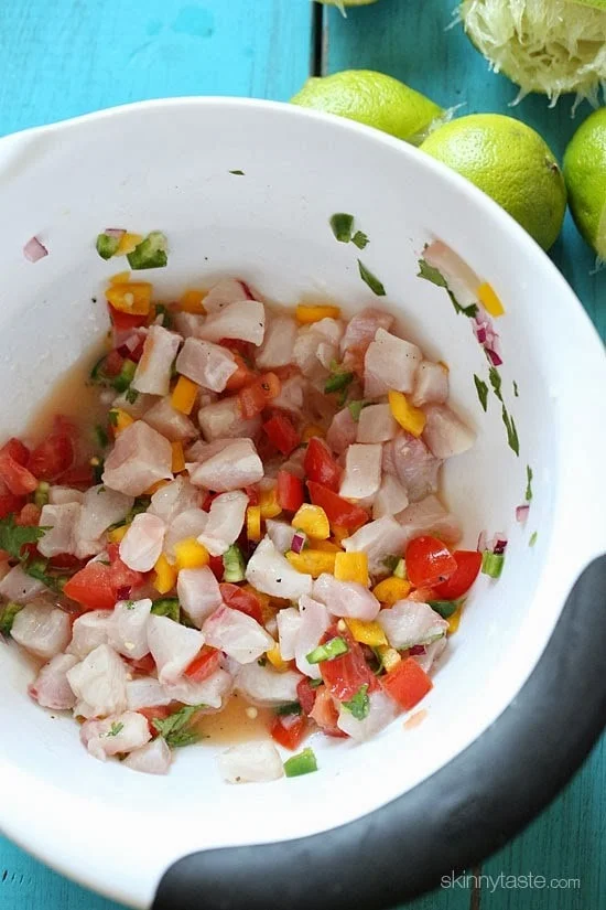 These Ceviche Cucumber Cups are made with fresh raw fish (shellfish), lime juice, onions and cilantro, making it gluten-free, paleo friendly and low-carb!