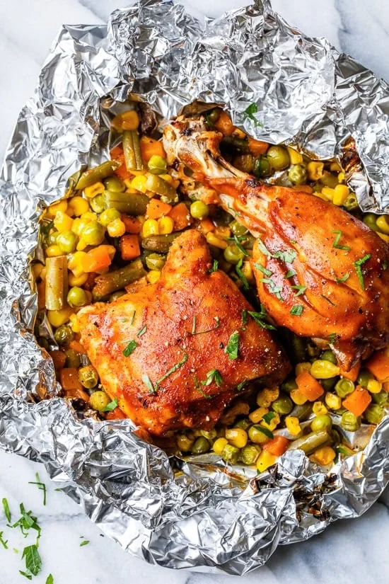 These easy 5-ingredient BBQ Chicken Foil Packets can be baked in the oven or made on the grill! An easy meal-in-one and the best part, easy cleanup!