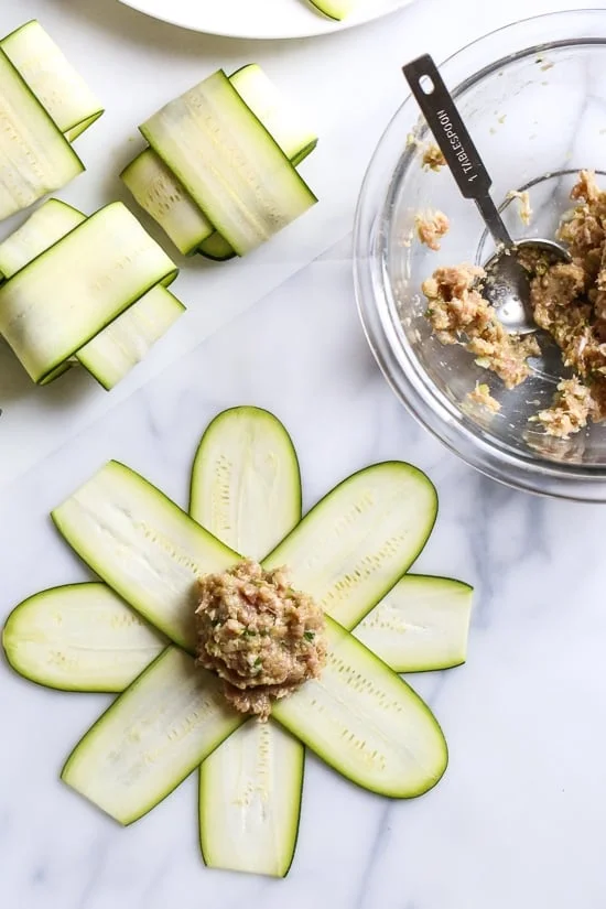 These low-carb pork dumplings, made with zucchini in place of dough are so dang good, you won't miss the carbs! They are also keto, paleo, gluten-free and whole30 friendly!