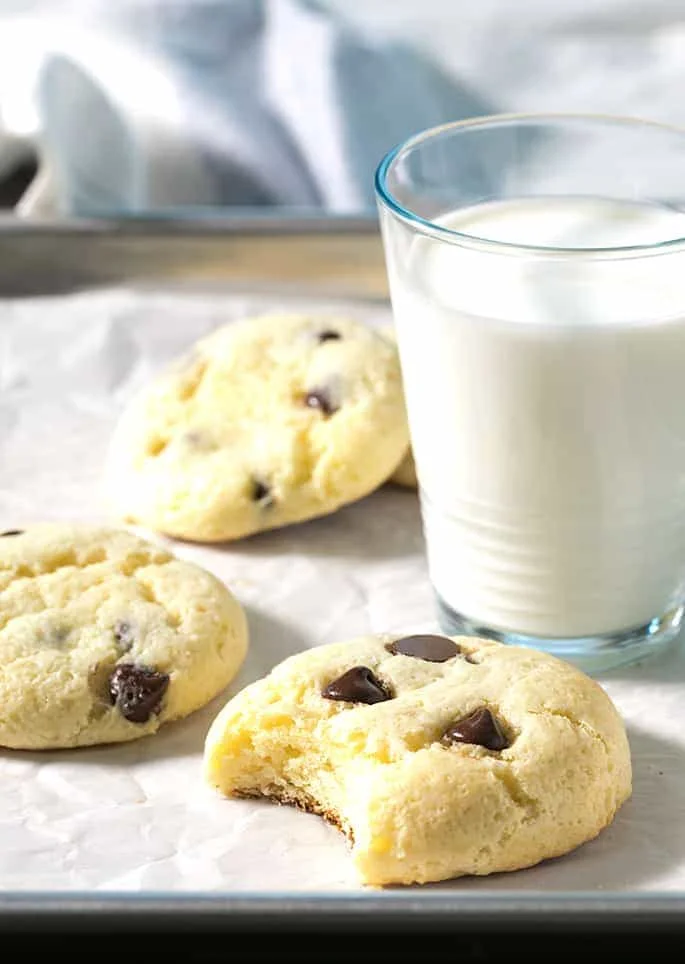 These soft and chewy cheesecake cookies are made by dressing up a vanilla cake mix with cream cheese and eggs. The chocolate chips are optional, but highly recommended!