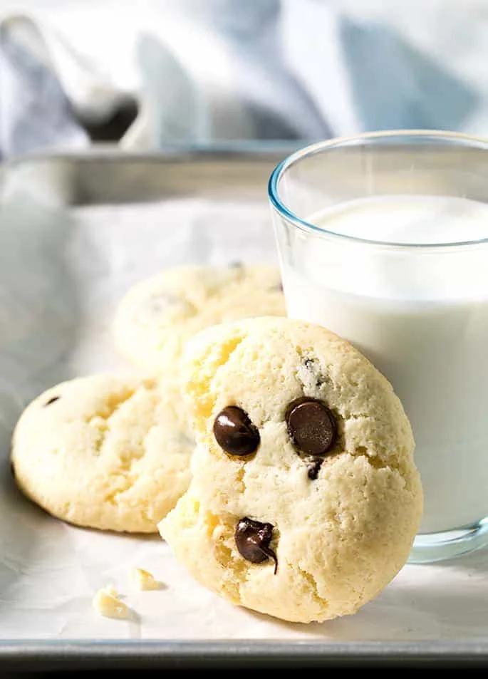 These soft and chewy cheesecake cookies are made by dressing up a vanilla cake mix with cream cheese and eggs. The chocolate chips are optional, but highly recommended!