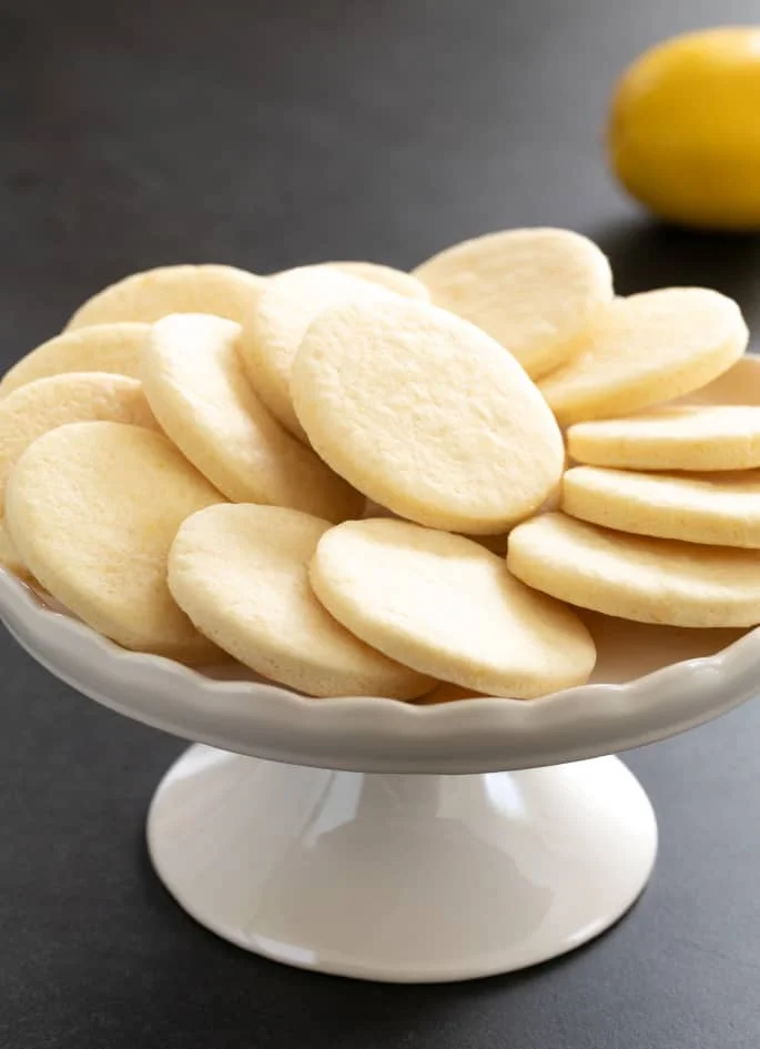 These soft, chewy cutout gluten free lemon sugar cookies are just like Lofthouse cookies, but with a simple lemon icing and just enough bright, citrus flavor.