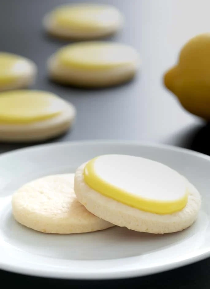 These soft, chewy cutout gluten free lemon sugar cookies are just like Lofthouse cookies, but with a simple lemon icing and just enough bright, citrus flavor.