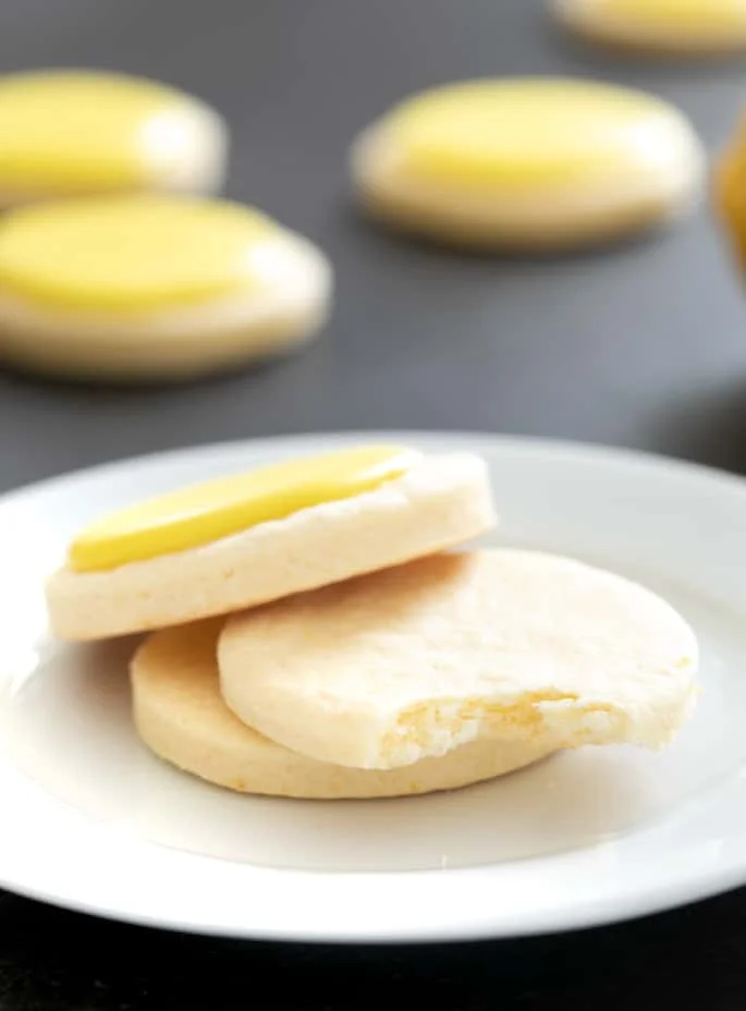 These soft, chewy cutout gluten free lemon sugar cookies are just like Lofthouse cookies, but with a simple lemon icing and just enough bright, citrus flavor.