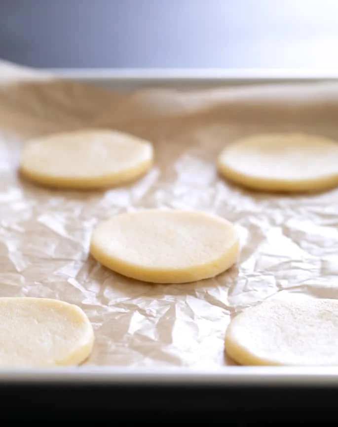 These soft, chewy cutout gluten free lemon sugar cookies are just like Lofthouse cookies, but with a simple lemon icing and just enough bright, citrus flavor.