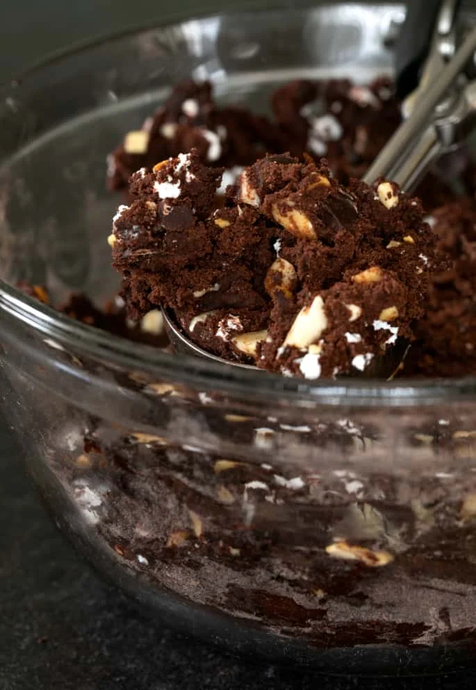 These super thick gluten free rocky road chocolate cookies are rich double chocolate chip cookies packed with nuts and marshmallows.