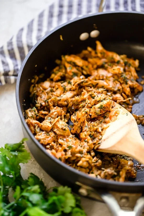 These Zucchini Chicken Enchilada Roll Ups are filled seasoned shredded chicken, topped with enchilada sauce and cheese. Delicious, and perfect for Keto, gluten-free or low-carb diets.