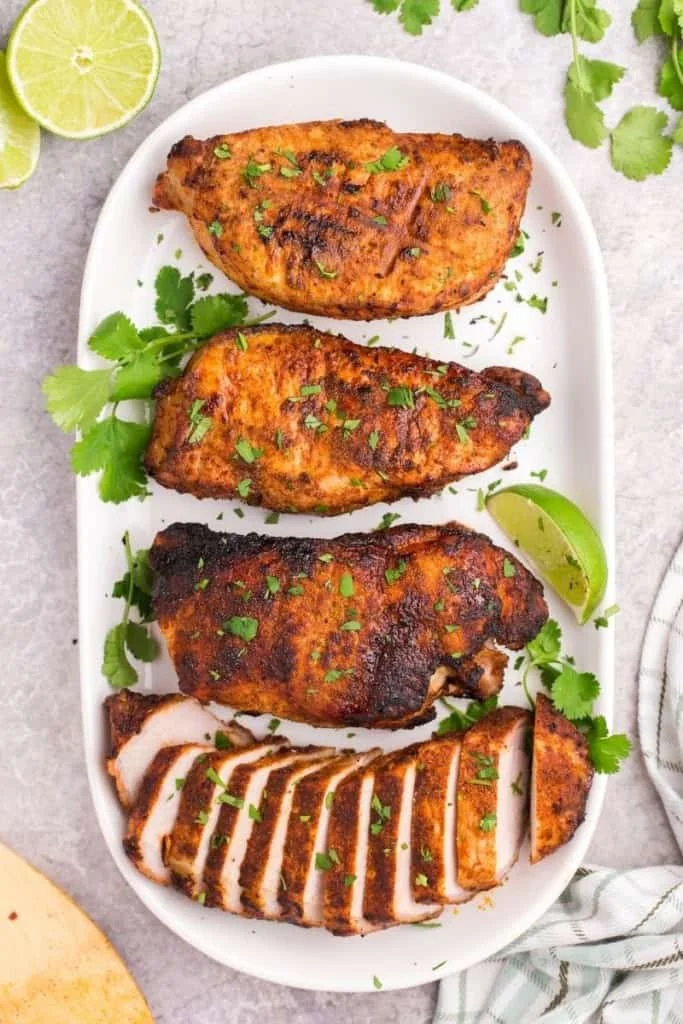 thick pork chops on plate with cilantro lime seasoning