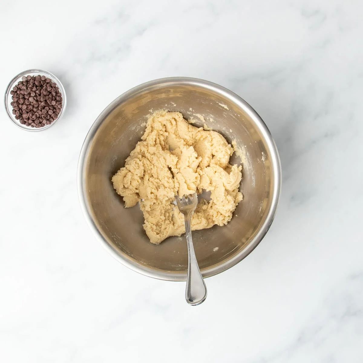 Thickened mixture in the bowl after heat-treated and cooled gluten free flour is added and stirred in.