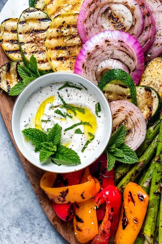 This beautiful, Grilled Vegetable Platter with Yogurt Mint Sauce is so colorful. An easy summer side dish made with asparagus, zucchini, squash, red onion and bell peppers.