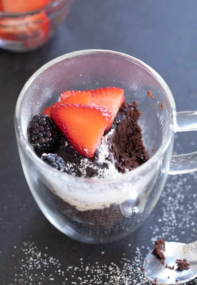 This chocolate Paleo mug cake is lightly sweet, rich, and easy enough for kids to make their own. The perfect healthy gluten free snack!