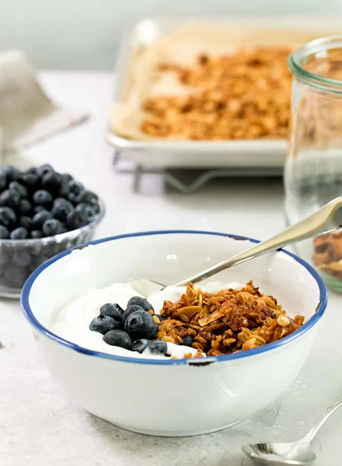 This crispy, crunchy protein granola is lower in fat and sugar, but still a satisfying breakfast or snack—in peanut butter or chocolate variety!