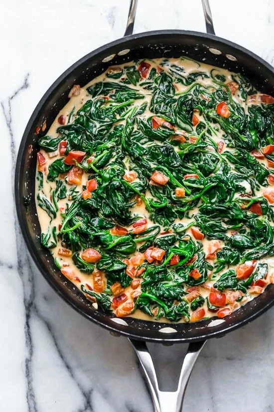 This easy Fish Florentine recipe, made with a pan seared firm white fish served on a creamy bed of spinach feels like something you would order out in a fancy restaurant!