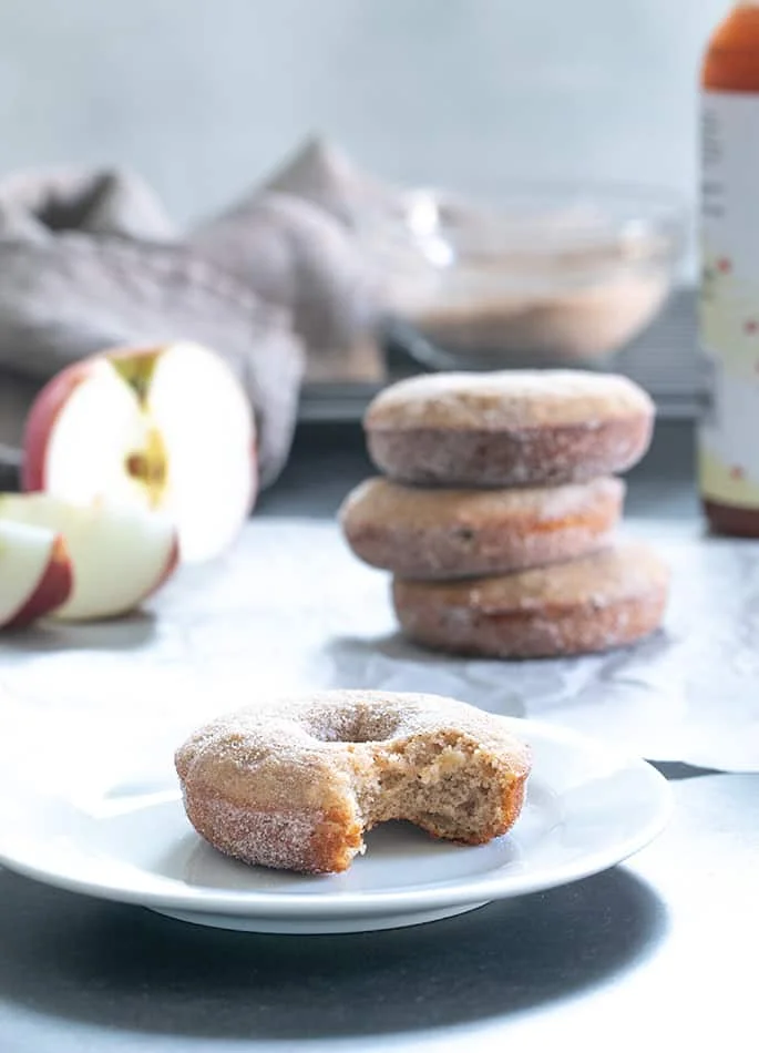 This easy gluten free apple cider donuts recipe is the cure for what ails you when you go to the apple orchard—but can't buy their sweet-smelling baked goods!
