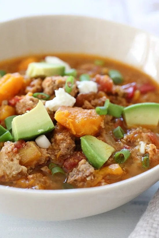 This easy Slow Cooker Paleo Jalapeno Popper Chicken Chili recipe is perfect for Fall, football games, and chili season!