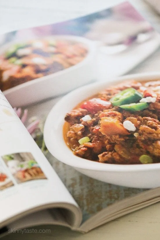 This easy Slow Cooker Paleo Jalapeno Popper Chicken Chili recipe is perfect for Fall, football games, and chili season!