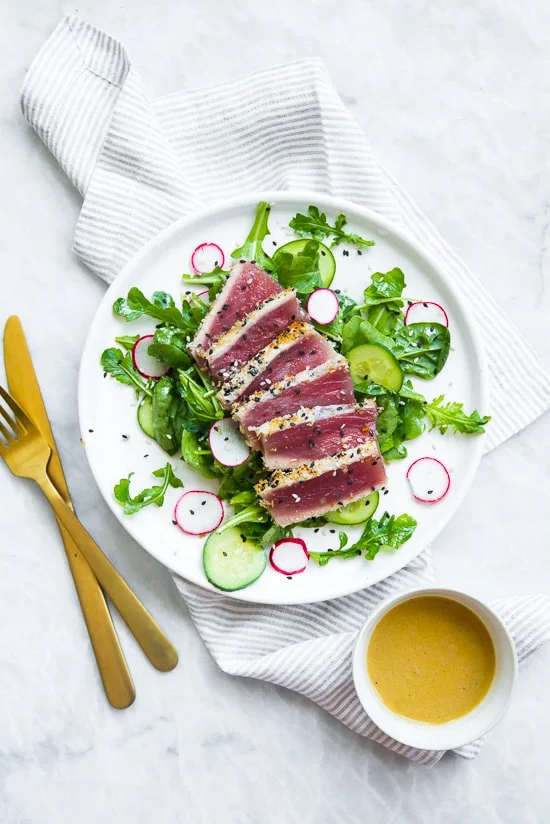 This panko and sesame crusted seared tuna on a bed of arugula and spinach salad, all topped with a wasabi butter sauce, takes Japanese food to whole new level! 